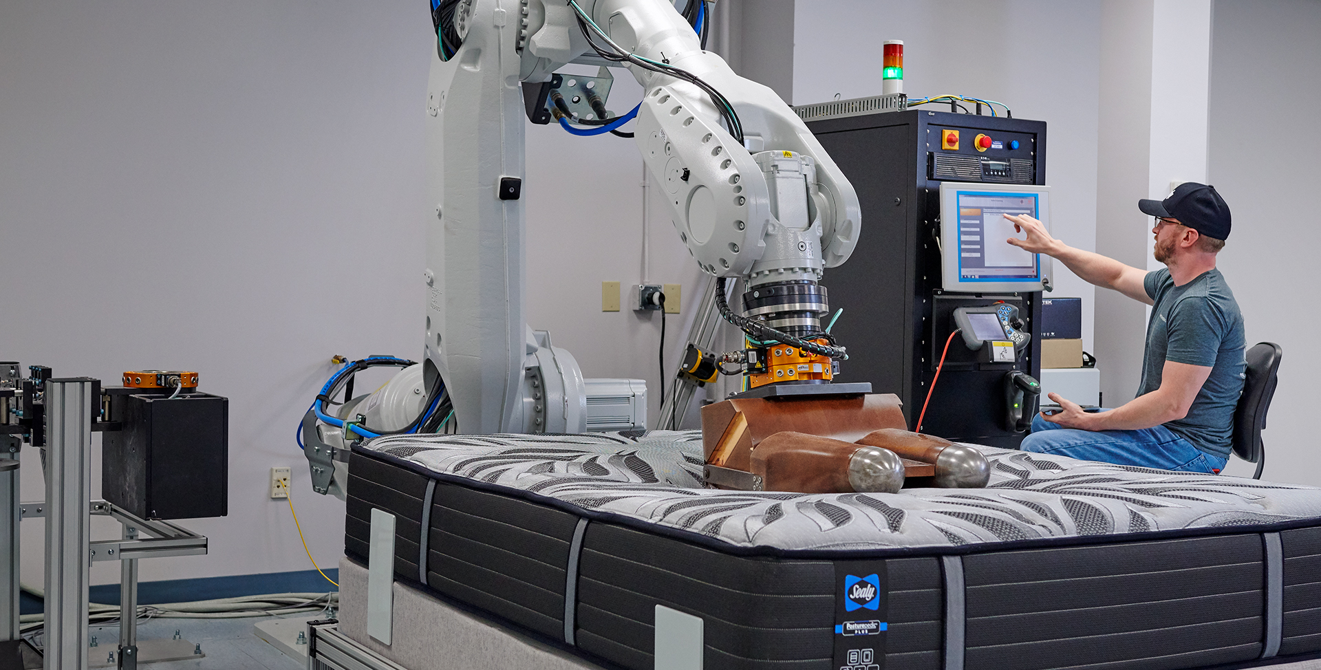 Trinity factory worker testing a Sealy® mattress